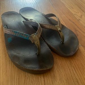 Worn shoes /rainbow flip flops